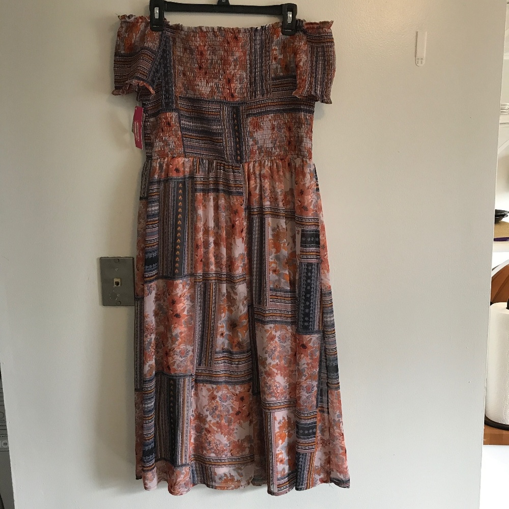 Off the shoulder, knee length dress.